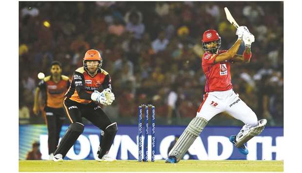 Kings XI Punjab batsman K L Rahul (right) plays a shot as Sunrisers Hyderabad wicket-keeper Johny Bairstow looks on during the 2019 Indian
