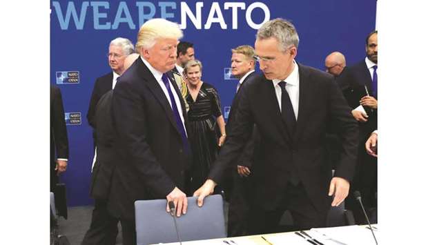 Nato Secretary General Jens Stoltenberg (right) and US President Donald Trump take a seat during a working dinner meeting at the Nato (North Atlantic Treaty Organisation) headquarters in Brussels in this May 25, 2017 file picture.