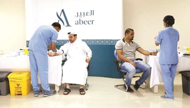 Residents get their health checked by medical staff.