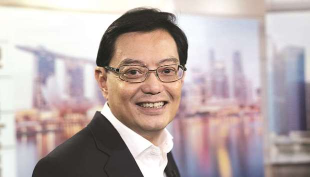 Heng Swee Keat, Singaporeu2019s finance minister, poses for a photograph following a Bloomberg Television interview in Singapore. Heng reiterated that a potential worsening of the US-China trade war is a risk to the global economy, with the two powers yet to ink an agreement that would relieve any of the tariffs put in place on $360bn in goods.