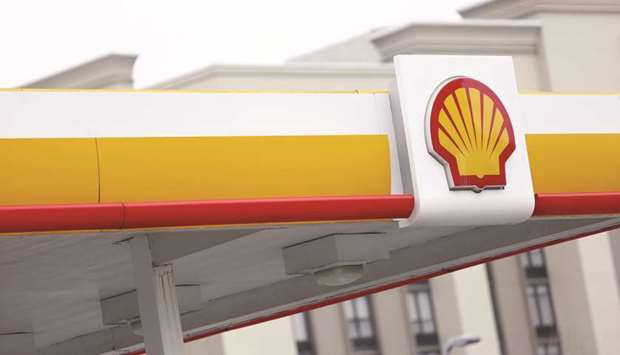 Signage is displayed at a Royal Dutch Shell gas station in Louisville, Kentucky. The firm has entered Chinau2019s shale oil sector, signing an agreement with state-owned Sinopec to study an East China block, part of the nationu2019s early efforts to unlock the potentially massive unconventional resource.
