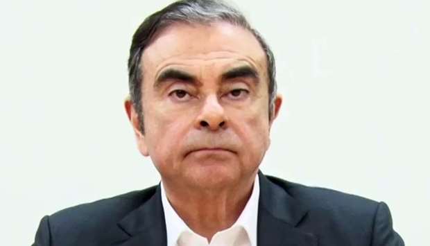 This screen grab from handout video released on April 9, 2019 by representatives of former Nissan chief Carlos Ghosn shows Ghosn preparing to speak at the beginning of a video message recorded before his rearrest earlier this month in Tokyo