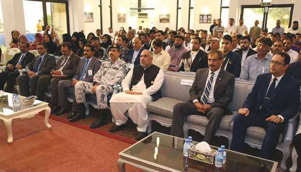 INTERACTION: Speaker Asad Qaiser, centre, seated with Syed Ahsan Raza Shah, Ambassador of Pakistan, second right, and other officers of the Pakistan embassy in the front row. along with members of the community.                                                                                                  Photos supplied