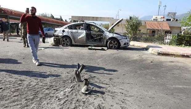 An damaged vehicle in Hama after a missile strike by militants on April 7.
