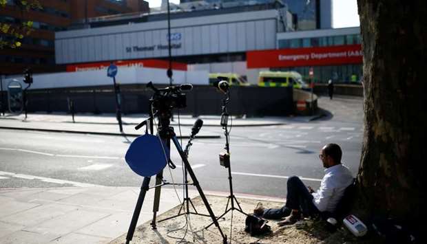 Media outside St Thomas' Hospital after British Prime Minister Boris Johnson spent a third night in intensive care after his coronavirus (Covid-19) symptoms worsened on Monday, in London