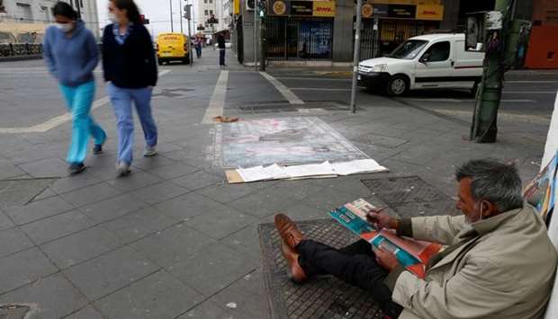 Homeless, and self-taught-painter Humberto Vasquez,58, is seen on the street painting his pictures during the pandemic of the coronavirus disease (Covid-19) in Valparaiso, Chile