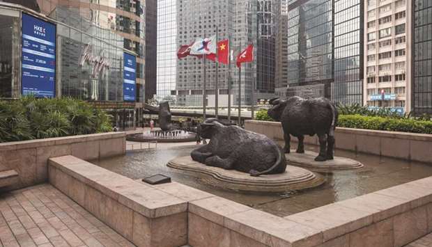 Sculptures seen outside the Exchange Square complex which houses the Hong Kong Stock Exchange. The Hang Seng index closed up 1.9% to 23,603.48 points yesterday.
