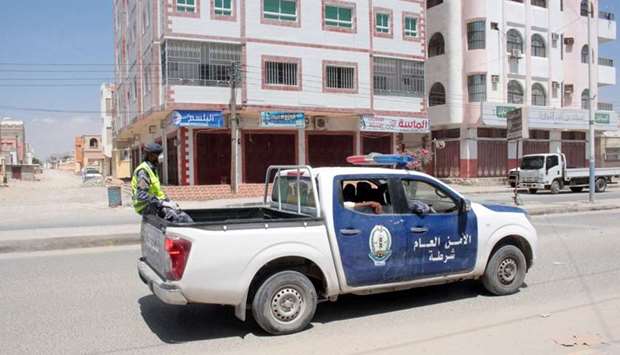 A police vehicle patrols a street during a curfew after the stateu2019s first case of Covid-19, was announced, in Al-Sheher, Hadhramout province, yesterday.