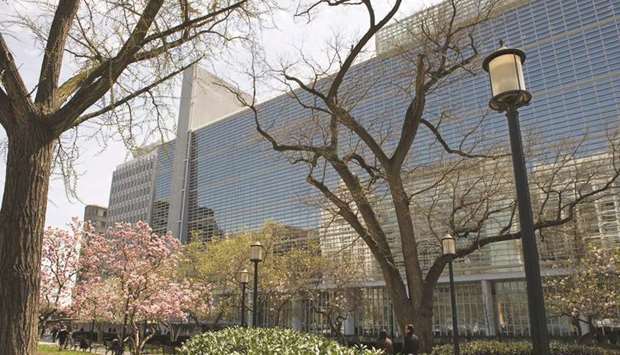 Pedestrians walk past the World Bank headquarters in Washington, DC.