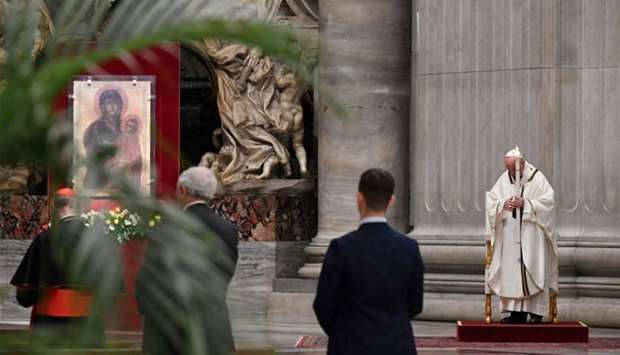 Pope Francis praying during Easter's Holy Saturday Vigil held behind closed doors at St. Peter's Basilica in the Vatican on April 11