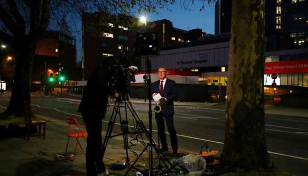 Media outside St Thomas' Hospital in Central London, where Prime Minister Boris Johnson has been moved from intensive care back to the ward, in London, Britain on April 9
