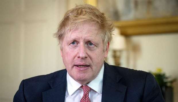 A handout image released by 10 Downing Street, shows Britain's Prime Minister Boris Johnson as he delivers a television address after returning to 10 Downing Street after being discharged from St Thomas' Hospital, in central London