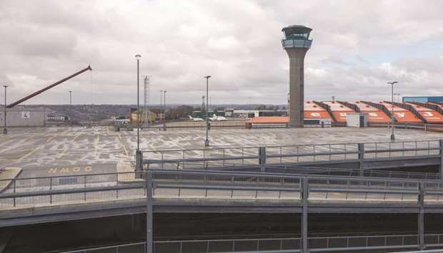 The air traffic control tower stands over an empty car park at London Luton Airport. Aviation industry captains who have been working from a scenario of severe travel restrictions lasting for three months say global airlines may burn through $61bn of their cash reserves during the second quarter ending in June, while posting a quarterly net loss of $39bn.