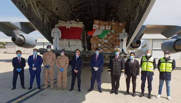 Dignitaries and military officers upon the arrival of the medical aid from Qatar