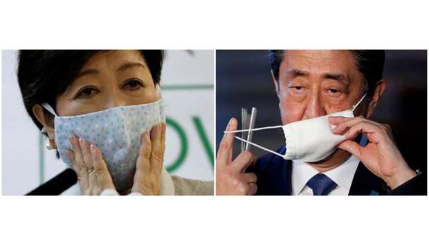 This combination picture shows Tokyo Governor Yuriko Koike attending a news conference and Japanu2019s Prime Minister Shinzo Abe taking off his face mask as he arrives to speak to the media, on Japanu2019s response to the coronavirus outbreak, in Tokyo, Japan.