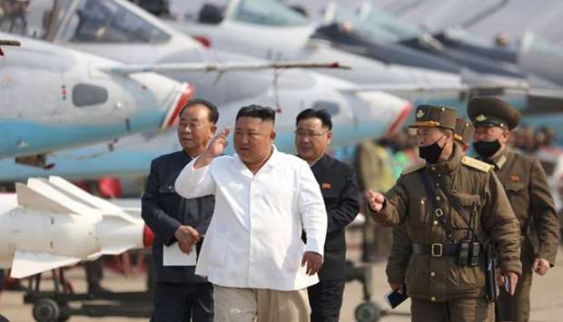 North Korean leader Kim Jong Un visits a pursuit assault plane group under the Air and Anti-Aircraft Division in the western area in this undated image released by North Korea's Korean Central News Agency (KCNA) in Pyongyang on April 12