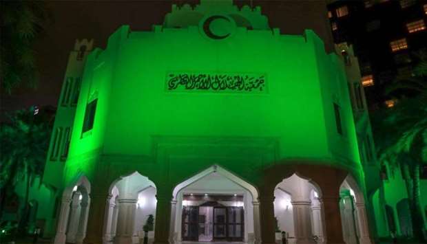 The QRCS building lit up in green.rnrn