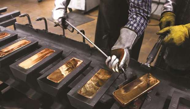 A worker uses a special tool to remove red hot gold ingots from their moulds in the foundry at the JSC Krastsvetmet non-ferrous metals plant in Russia. Gold has rarely been a hotter trade, but the worldu2019s two most important markets remain out of sync. In New York, the price of gold topped $1,750 for the first time in seven years on April 9. In London, it still hasnu2019t caught up.