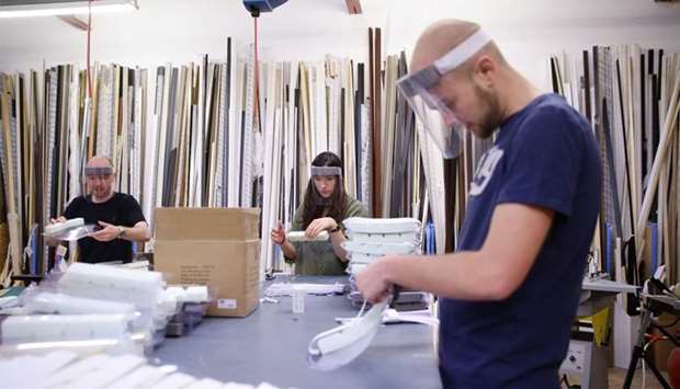 Employees of Fine Art Printing services in Croydon make PPE visors for the NHS, as the spread of the coronavirus disease continues, Croydon, Britain on April 16