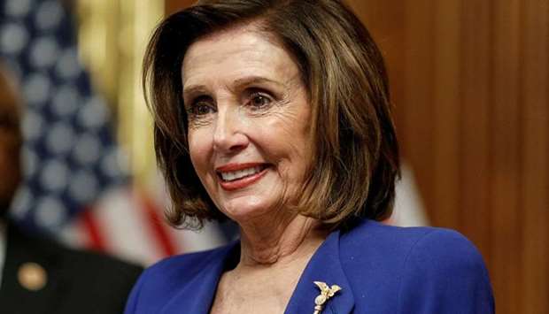 U.S. House Speaker Nancy Pelosi hosts a signing ceremony after the House of Representatives approved a $2.2 trillion coronavirus aid package at the US Capitol in Washington on March 27
