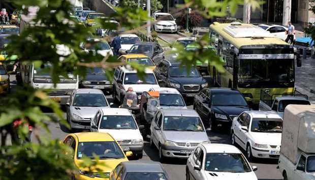 Cars pack a street in the Iranian capital Tehran, on April 18 after authorities eased lockdown measures due to the COVID-19 pandemic.