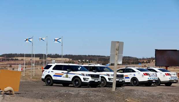 Royal Canadian Mounted Police (RCMP) monitor the TransCanada Highway while searching for Gabriel Wortman, who they describe as a shooter of multiple victims, near Fort Lawrence, Nova Scotia, Canada