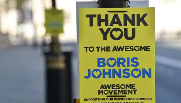 A sign in support of Britain's Prime Minister Boris Johnson is seen attached to a post in Whitehall in central London on April 19, during the novel coronavirus COVID-19 pandemic