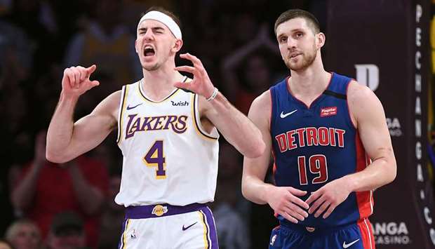 In this file photo taken on on Sunday, January 5, 2020, The Los Angeles Lakersu2019 Alex Caruso (left) celebrates his dunk against the Detroit Pistonsu2019 Svi Mykhailiuk in the fourth quarter at Staples Center in Los Angeles . (TNS)