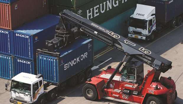 A Kalmar reachstacker unloads a container from a truck at the Sun Kwang Newport Terminal in Incheon. South Koreau2019s shipments fell 26.9% in the first 20 days of April from a year earlier, sharply reversing 9.3% growth in the March 1-20 period, the Korea Customs Service data showed yesterday.