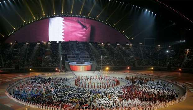 FILE PHOTO: A general view of the Khalifa Stadium with the Qatari flag being displayed on a screen during the closing ceremony of the 15th Asian Games in Doha, December 15, 2006.