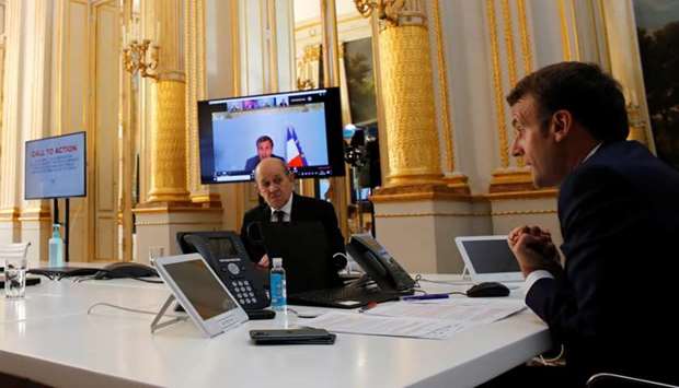 French President Emmanuel Macron speaks with Tedros Adhanom Ghebreyesus, Director General of the World Health Organization and other world leaders about the coronavirus outbreak during a video conference at the Elysee Palace in Paris, France
