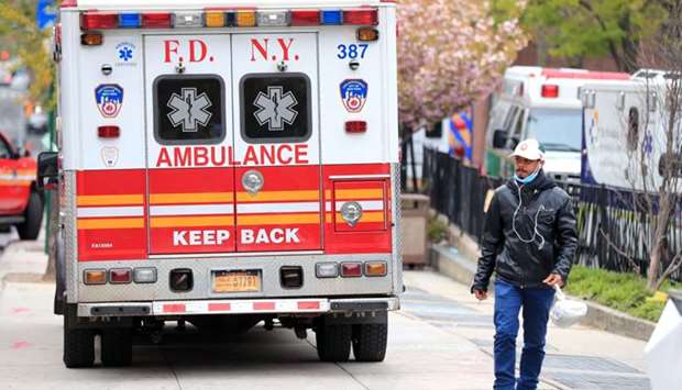 A FDNY ambulance approaches the entrance to the Brooklyn Hospital Center in the Clinton Hill neighborhood of the Brooklyn borough of New York City