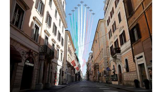 The Frecce Tricolori perform over a deserted Via del Corso on Liberation Day following the outbreak of the coronavirus disease in Rome yesterday