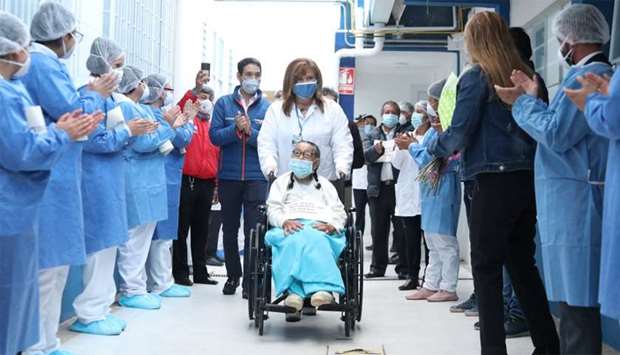 Aged patient's recovery celebrated Joaquina Garzon, 92, is applauded by medical staff, during her release from the Suesca Hospital where she recovered, amid the outbreak of the coronavirus disease (Covid-19) in Suesca, Colombia, last week