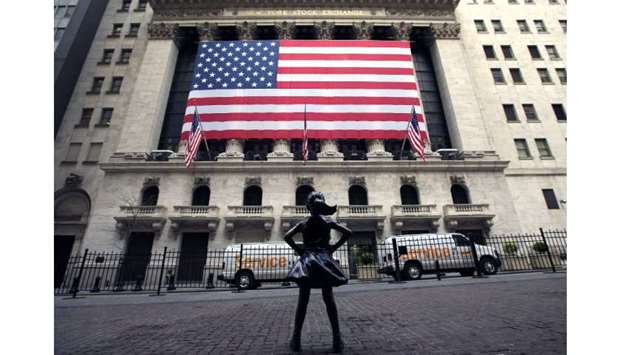 The Fearless Girl statue stands alone in front of the New York Stock Exchange as New York City locks down to fight the coronavirus.
