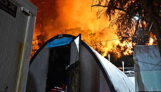 The blaze on Sunday evening was started ,amid internal disputes (between residents),, Migration Ministry Secretary Manos Logothetis said.