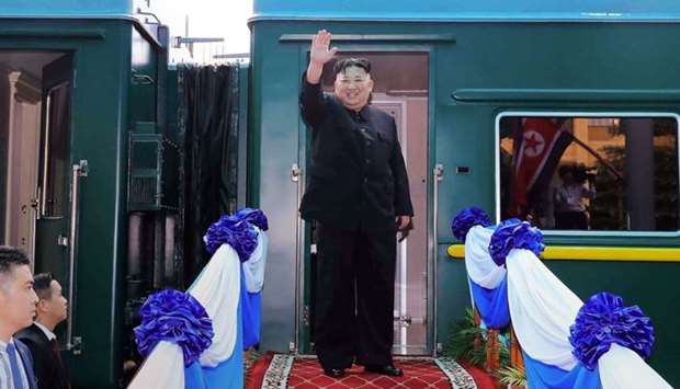 This file photo taken on March 2, 2019 shows North Korea's leader Kim Jong Un waving before boarding his train at the Dong Dang railway station in the Vietnamese town of Lang Son