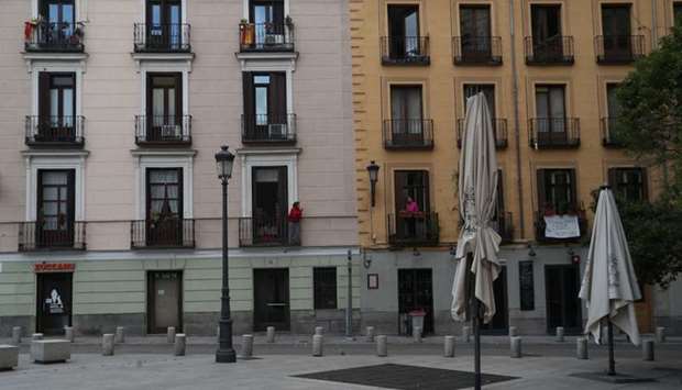 Women talk from the balconies of their homes during lockdown, amid the coronavirus disease outbreak, in Madrid, Spain