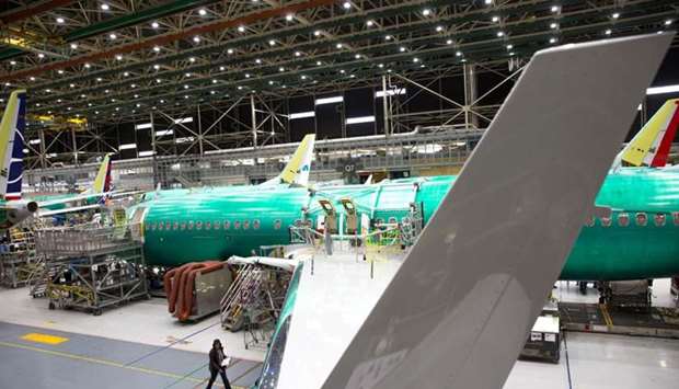 Employees work on Boeing 737 MAX airplanes at the Boeing Renton Factory in Renton, Washington. File picture: March 27, 2019,