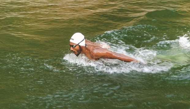 Indiau2019s swimmer SP Likith trains in a makeshift pool at the farmhouse of his coach in Adyanadka of Karnataka state. (AFP)