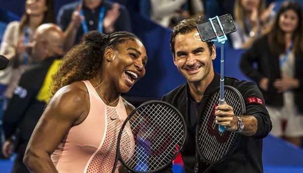 In this January 1, 2019, picture, Serena Williams of the US (left) and Roger Federer of Switzerland take a selfie following their mixed doubles match at the Hopman Cup in Perth, Australia. (AFP)
