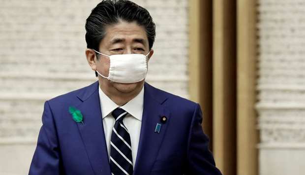 Japanu2019s Prime Minister Shinzo Abe wears a protective mask after a news conference in Tokyo earlier this month. (Reuters)
