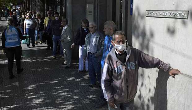 Pensioners queue outside a bank during the Covid-19 outbreak in Buenos Aires yesterday.