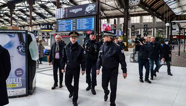 Police prefect Didier Lallement (left) is seen at Parisu2019s Gare de Lyon train station yesterday, on the 18th day of a lockdown in France aimed at curbing the spread of the coronavirus.