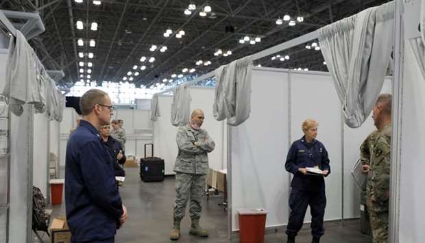 A Commissioned Corps Officer from the United States Public Health Service briefs her personnel in phase 2 of the Javits New York Medical Station at the Jacob K. Javits Convention Center during the coronavirus disease (Covid-19) outbreak in Manhattan, New York City