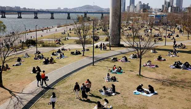 People enjoy a picnic at a Han River Park following the outbreak of the coronavirus disease (Covid-19), in Seoul yesterday.