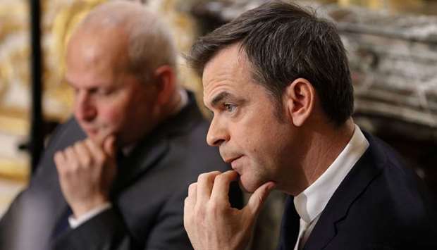French Minister for Solidarity and Health Olivier Veran March looks on during a news conference in Paris, France, on the 11th day of a strict nationwide confinement seeking to halt the spread of Covid-19.