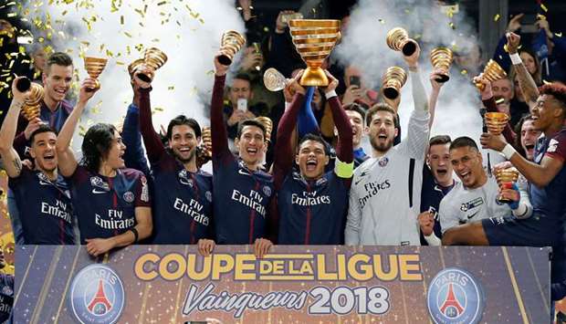 In this March 31, 2018, picture, Paris Saint-Germain players celebrate their record eighth French League Cup title after beating AS Monaco 3-0 in the final at the Nouveau Stade de Bordeaux. (Reuters)