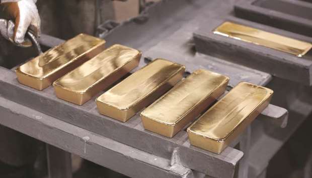 Freshly cast gold ingot bars sit in the foundry at the JSC Krastsvetmet non-ferrous metals plant in Krasnoyarsk, Russia. As the coronavirus brings economies around the world to a standstill, gold is rivalling Treasuries and the dollar as the best-performing major asset this year.