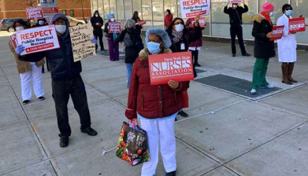 Nurses at Harlem Hospital hold a rally demanding greater access to PPE in front of the hospital in Manhattan, New York City.